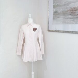 Chic White Button-Up Dress with Crest